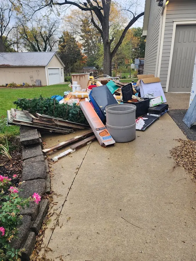 Dumpster being loaded with debris for Commercial Dumpster Rental in Forest